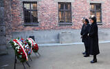 In this image provided by the US Consulate General in Krakow, US House Speaker Nancy Pelosi, center, and speakers of Poland's parliament lay wreaths at the executions Death Wall of the World War II Nazi death camp of Auschwitz-Birkenau during a visit to the site of the former camp just days before the 75th anniversary of its 1945 liberation by the Soviet troops, at the Auschwitz-Birkenau Museum, in southern Poland, on Tuesday, Jan. 21, 2020. (US Consulate General in Krakow via AP)