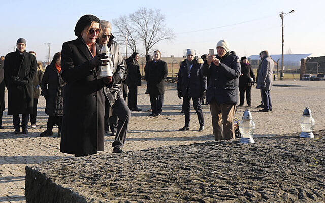 In this image provided by the US Consulate General in Krakow, US House Speaker Nancy Pelosi places a memorial light on the monument to some 1.1 million victims of the World War II Nazi death camp of Auschwitz-Birkenau during a visit to the site of the former camp just days before the 75th anniversary of its 1945 liberation by the Soviet troops, at the Auschwitz-Birkenau Museum, in southern Poland, on Tuesday, Jan. 21, 2020. (US Consulate General in Krakow via AP) In this image provided by the US Consulate General in Krakow, US House Speaker Nancy Pelosi places a memorial light on the monument to some 1.1 million victims of the World War II Nazi death camp of Auschwitz-Birkenau during a visit to the site of the former camp just days before the 75th anniversary of its 1945 liberation by the Soviet troops, at the Auschwitz-Birkenau Museum, in southern Poland, on Tuesday, Jan. 21, 2020. (US Consulate General in Krakow via AP)