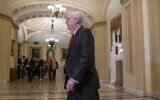 US Senate Majority Leader Mitch McConnell arrives at the Senate for the start of the impeachment trial of US President Donald Trump on charges of abuse of power and obstruction of Congress, at the Capitol in Washington, January 21, 2020. (AP Photo/J. Scott Applewhite)