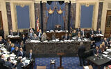 In this image from video, White House counsel Pat Cipollone waits in the US Senate chamber to be recognized by the presiding officer, Supreme Court Chief Justice John Roberts, during the impeachment trial against President Donald Trump in the Senate at the US Capitol in Washington, January 21, 2020. (Senate Television via AP)