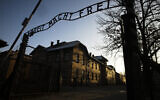 In this December 6, 2019, file photo, the sun lights the buildings behind the entrance of the former Nazi death camp of Auschwitz-Birkenau in Oswiecim, Poland. (Photo/Markus Schreiber, File)