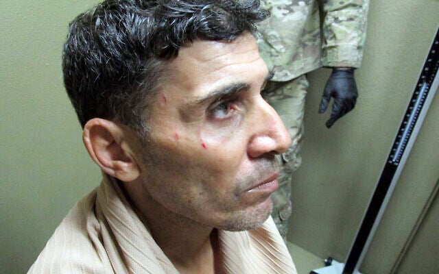 This undated image provided by the FBI in a US District Court filing in Washington on Feb. 29, 2019, shows Mustafa al-Imam after his capture in October 2017. A federal judge has sentenced Mustafa al-Imam to 19 years in federal prison for helping to plan the 2012 attacks in Benghazi. (FBI via AP) This undated image provided by the FBI in a US District Court filing in Washington on Feb. 29, 2019, shows Mustafa al-Imam after his capture in October 2017. A federal judge has sentenced Mustafa al-Imam to 19 years in federal prison for helping to plan the 2012 attacks in Benghazi. (FBI via AP)