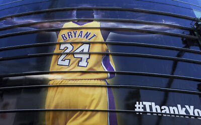 In this April 13, 2016 file photo a giant banner congratulating Kobe Bryant is draped around Staples Center before his last NBA basketball game, a contest against the Utah Jazz, in downtown Los Angeles. Bryant, a five-time NBA champion and a two-time Olympic gold medalist, died in a helicopter crash in California on Sunday, Jan. 26, 2020. He was 41. (AP Photo/Richard Vogel, file)