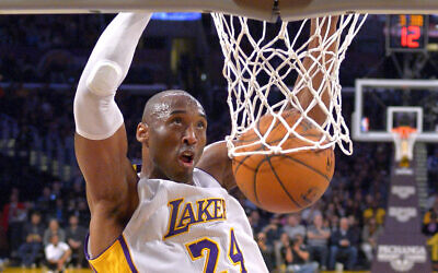 In this January 4, 2015 file photo Los Angeles Lakers guard Kobe Bryant dunks during the first half of an NBA basketball game against the Indiana Pacers in Los Angeles. (AP Photo/Mark J. Terrill)