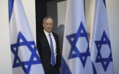 In this November 20, 2019, file photo, Blue and White party leader Benny Gantz arrives to address media in Tel Aviv. (AP Photo/Oded Balilty, File)