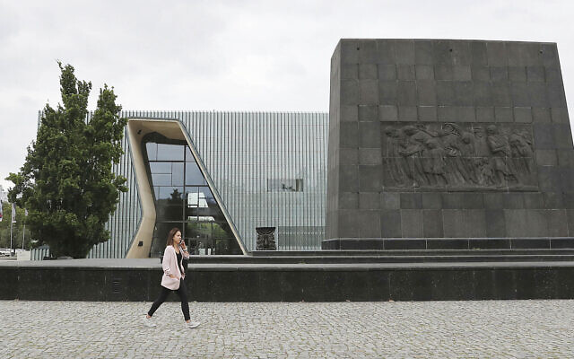 A woman passes the POLIN Museum of the History of Polish Jews in Warsaw, Poland, July 16, 2019. (AP Photo/Czarek Sokolowski)