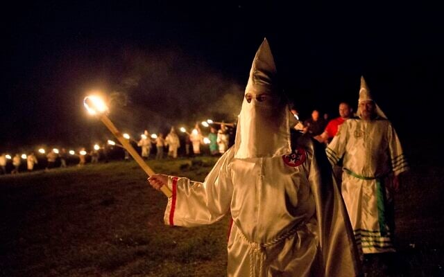 Illustrative: Members of the Ku Klux Klan participate in cross burnings after a 'white pride' rally in Georgia on April 23, 2016. (AP Photo/John Bazemore) Illustrative: Members of the Ku Klux Klan participate in cross burnings after a 'white pride' rally in Georgia on April 23, 2016. (AP Photo/John Bazemore)
