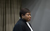 Public Prosecutor Fatou Bensouda enters the courtroom for the trial of Dominic Ongwen, a senior commander in the Lord's Resistance Army, whose fugitive leader Kony is one of the world's most-wanted war crimes suspects, at the International Court in The Hague, Netherlands, December 6, 2016. (AP Photo/Peter Dejong, Pool)