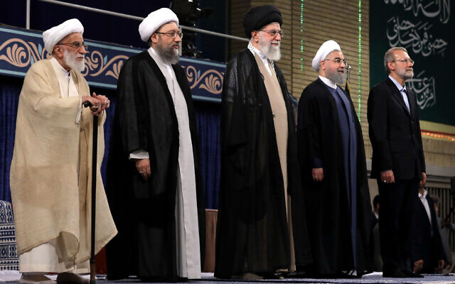 In this picture released by official website of the office of the Iranian supreme leader, Supreme Leader Ayatollah Ali Khamenei, center, President Hassan Rouhani, second right, parliament speaker Ali Larijani, right, judiciary chief Sadeq Larijani, second left, and head of the Assembly of Experts and secretary of Guardian Council Ahmad Jannati listen to the national anthem at the start of the official endorsement ceremony of President Rouhani in Tehran, Iran, August 3, 2017. (Office of the Iranian Supreme Leader via AP) In this picture released by official website of the office of the Iranian supreme leader, Supreme Leader Ayatollah Ali Khamenei, center, President Hassan Rouhani, second right, parliament speaker Ali Larijani, right, judiciary chief Sadeq Larijani, second left, and head of the Assembly of Experts and secretary of Guardian Council Ahmad Jannati listen to the national anthem at the start of the official endorsement ceremony of President Rouhani in Tehran, Iran, August 3, 2017. (Office of the Iranian Supreme Leader via AP)