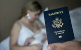 In this photo taken on Jan. 24, 2019, Denis Wolok, the father of 1-month-old Eva's father, shows the child's US passport during an interview with The Associated Press in Hollywood, Florida (AP Photo/Iuliia Stashevska)