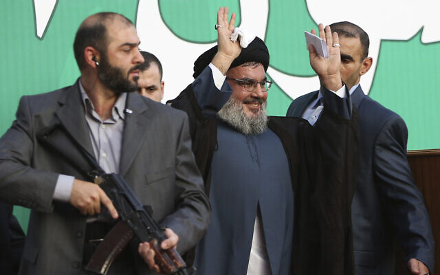Hezbollah leader Sheik Hassan Nasrallah, center, escorted by his bodyguards, waves to a crowd of tens of thousands of supporters during a rally in a southern suburb of Beirut, Lebanon, September 17, 2012. AP Photo/Hussein Malla, File) Hezbollah leader Sheik Hassan Nasrallah, center, escorted by his bodyguards, waves to a crowd of tens of thousands of supporters during a rally in a southern suburb of Beirut, Lebanon, September 17, 2012. AP Photo/Hussein Malla, File)