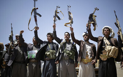 In this September 21, 2019 file photo, Shiite Houthi tribesmen hold their weapons as they chant slogans during a tribal gathering showing support for the Houthi movement, in Sanaa, Yemen. (AP Photo/Hani Mohammed)