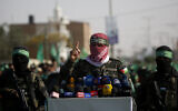 A spokesman for the armed wing of Gaza-ruling Hamas terror group talks to the press in the town of Khan Younis, southern Gaza Strip, November 11, 2019. (AP Photo/ Hatem Moussa)