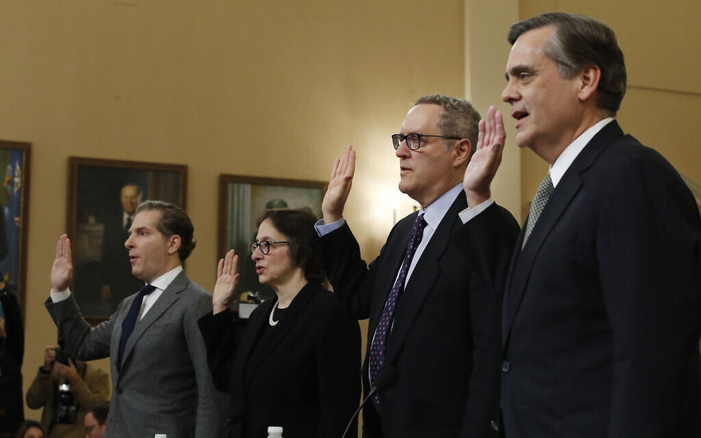 From left, Constitutional law experts, Harvard Law School professor Noah Feldman, Stanford Law School professor Pamela Karlan, University of North Carolina Law School professor Michael Gerhardt and George Washington University Law School professor Jonathan Turley are sworn in before testifying during a hearing before the House Judiciary Committee on the constitutional grounds for the impeachment of President Donald Trump, on Capitol Hill in Washington, Wednesday, December 4, 2019. (AP Photo/Alex Brandon)