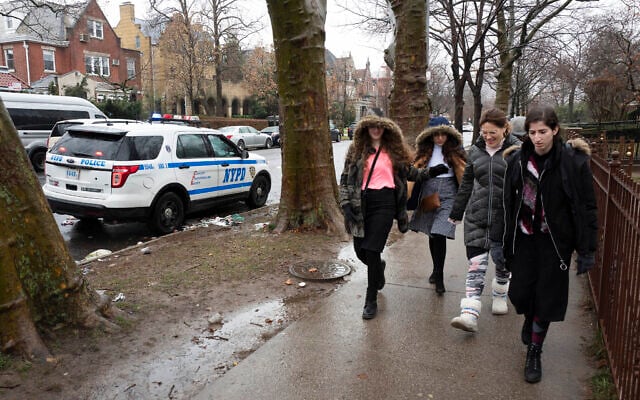 Jewish girls walk by a police car stationed in the Crown Heights neighborhood, Monday, Dec. 30, 2019 in the Brooklyn borough of New York. Police have increased patrols in the area following anti-Semitic attacks in the city and on an attack of a Hanukkah celebration in Monsey, N.Y. (AP Photo/Mark Lennihan) Jewish girls walk by a police car stationed in the Crown Heights neighborhood, Monday, Dec. 30, 2019 in the Brooklyn borough of New York. Police have increased patrols in the area following anti-Semitic attacks in the city and on an attack of a Hanukkah celebration in Monsey, N.Y. (AP Photo/Mark Lennihan)