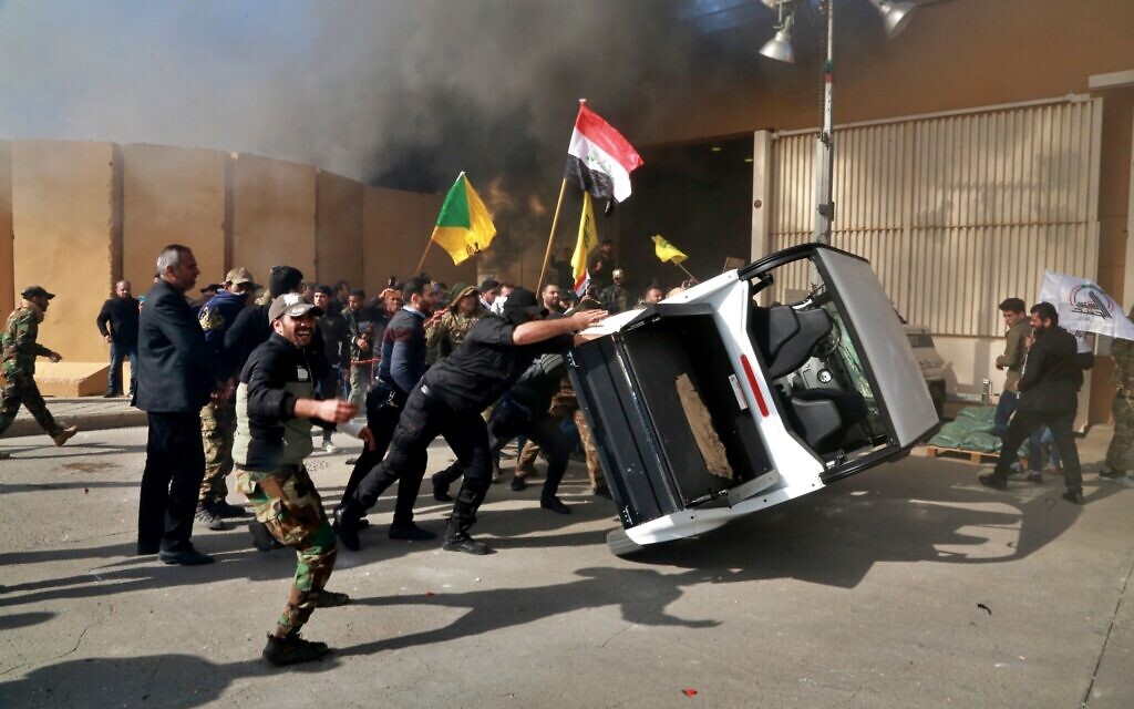Protesters damage property inside the US embassy compound, in Baghdad, Iraq, December 31, 2019. (AP Photo/Khalid Mohammed) Protesters damage property inside the US embassy compound, in Baghdad, Iraq, December 31, 2019. (AP Photo/Khalid Mohammed)