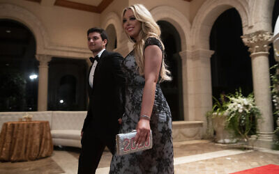 Tiffany Trump, the daughter of US President Donald Trump, and her boyfriend Michael Charbel Boulous arrive for a New Year's Eve party at the president's Mar-a-Lago property, December 31, 2019, in Palm Beach, Fla. (AP Photo/ Evan Vucci)