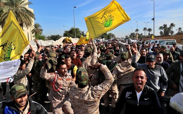 Pro-Iranian militiamen and their supporters chant slogans against the US in front of the US embassy in Baghdad, Iraq, January 1, 2020. (AP/Khalid Mohammed) Pro-Iranian militiamen and their supporters chant slogans against the US in front of the US embassy in Baghdad, Iraq, January 1, 2020. (AP/Khalid Mohammed)