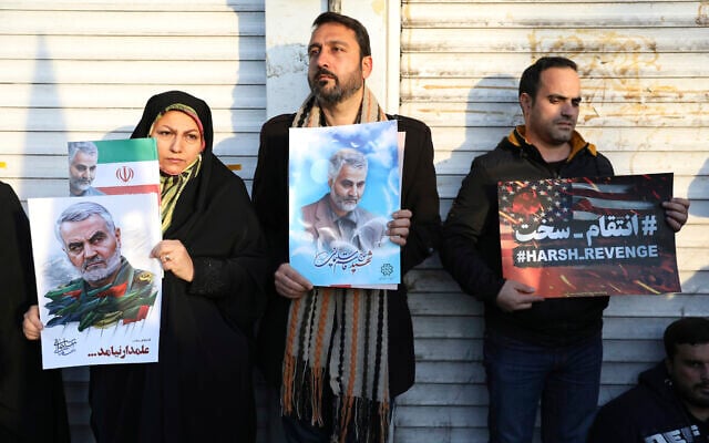 Mourners attend a funeral ceremony for Iranian Gen. Qassem Soleimani, shown in posters, and his comrades, who were killed in Iraq in a U.S. drone strike on Friday, at the Enqelab-e-Eslami (Islamic Revolution) square in Tehran, Iran, Jan. 6, 2020. (AP Photo/Ebrahim Noroozi)