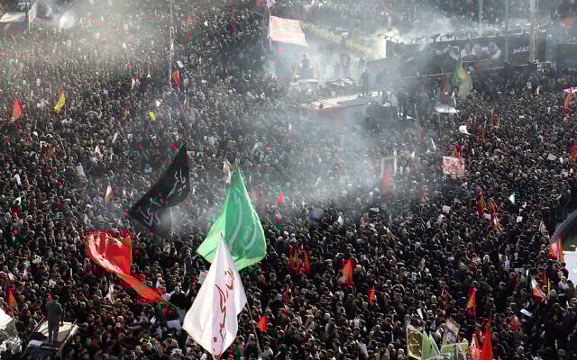 Mourners attend a funeral ceremony for Iranian Gen. Qassem Soleimani and his comrades, who were killed in Iraq in a U.S. drone strike on Friday, at the Enqelab-e-Eslami (Islamic Revolution) square in Tehran, Iran, Jan. 6, 2020. (AP Photo/Ebrahim Noroozi)