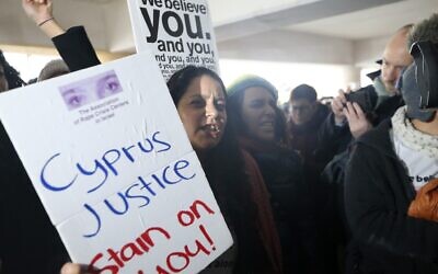 Israeli protesters shout slogans outside a court before the arrival of a 19 year-old British woman who was found guilty of making up claims she was raped by up to 12 Israelis, at Famagusta District Court on January 7, 2020 (AP/Petros Karadjias)