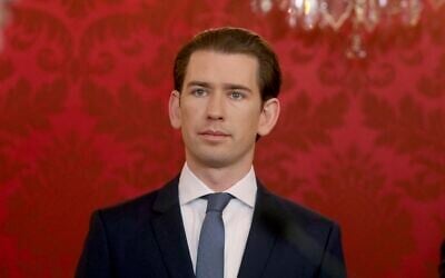 New Austrian Chancellor Sebastian Kurz listen during the swearing-in ceremony of the new Austrian government led by a conservative Austrian People's Party, OEVP, and the Austrian Green party in Vienna, Austria, Jan. 7, 2020. (AP Photo/Ronald Zak)