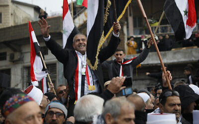 Druze men carry Sidqi al-Maqt, left, and Amal Abu Saleh as they wave Syrian flags upon their release from Israeli prison, in the Golan Heights town of Majdal Shams on the border with Syria, January 10, 2020. (AP Photo/Ariel Schalit) Druze men carry Sidqi al-Maqt, left, and Amal Abu Saleh as they wave Syrian flags upon their release from Israeli prison, in the Golan Heights town of Majdal Shams on the border with Syria, January 10, 2020. (AP Photo/Ariel Schalit)