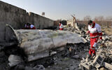 Rescue workers search the scene where a Ukrainian plane crashed in Shahedshahr, southwest of the capital Tehran, Iran, on January 8, 2020. (AP Photo/Ebrahim Noroozi)