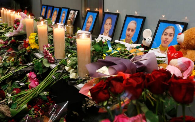 Flowers and candles are placed in front of portraits of the flight crew members of the Ukrainian 737-800 plane that crashed on the outskirts of Tehran, at a memorial inside Borispil international airport outside Kyiv, Ukraine, January 11, 2020. (AP Photo/Efrem Lukatsky) Flowers and candles are placed in front of portraits of the flight crew members of the Ukrainian 737-800 plane that crashed on the outskirts of Tehran, at a memorial inside Borispil international airport outside Kyiv, Ukraine, January 11, 2020. (AP Photo/Efrem Lukatsky)