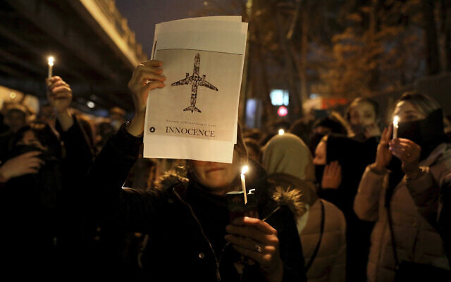 People gather for a candlelight vigil to remember the victims of the Ukraine plane crash, at the gate of Amri Kabir University where some of the victims of the crash were former students, in Tehran, Iran, January 11, 2020. (AP/Ebrahim Noroozi) People gather for a candlelight vigil to remember the victims of the Ukraine plane crash, at the gate of Amri Kabir University where some of the victims of the crash were former students, in Tehran, Iran, January 11, 2020. (AP/Ebrahim Noroozi)
