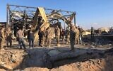 US soldiers stand at the site of an Iranian bombing at Ain al-Asad air base in Anbar, Iraq, Jan. 13, 2020. (AP/Qassim Abdul-Zahra)