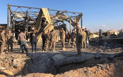 US soldiers stand at the site of an Iranian bombing at Ain al-Asad air base in Anbar, Iraq, Jan. 13, 2020. (AP/Qassim Abdul-Zahra)