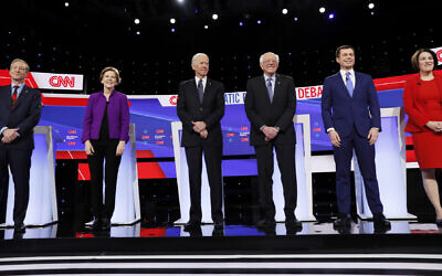 From left, Democratic presidential candidates businessman Tom Steyer, Sen. Elizabeth Warren, D-Mass., former Vice President Joe Biden, Sen. Bernie Sanders, I-Vt., former South Bend Mayor Pete Buttigieg, and Sen. Amy Klobuchar, D-Minn., stand on stage, Tuesday, Jan. 14, 2020, before a Democratic presidential primary debate hosted by CNN and the Des Moines Register in Des Moines, Iowa. (AP Photo/Charlie Neibergall)