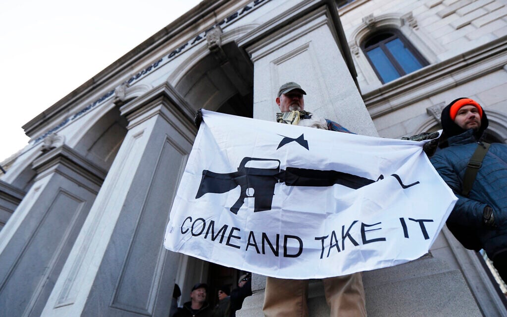 A demonstrator stands outside a court house during a pro-gun rally, Monday, Jan. 20, 2020, in Richmond, Va. (AP/Julio Cortez) A demonstrator stands outside a court house during a pro-gun rally, Monday, Jan. 20, 2020, in Richmond, Va. (AP/Julio Cortez)