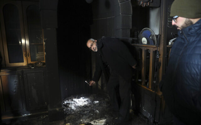 Palestinians visit a torched mosque in the Arab neighborhood of Sharafat in East Jerusalem on January 24, 2020 (AP Photo/Mahmoud Illean) Palestinians visit a torched mosque in the Arab neighborhood of Sharafat in East Jerusalem on January 24, 2020 (AP Photo/Mahmoud Illean)