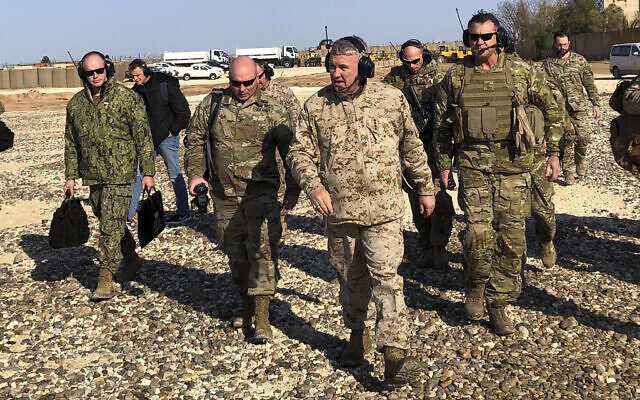 Gen. Frank McKenzie, center front, the top US commander for the Middle East, walks as he visits a military outpost in Syria on January 25, 2020. (AP Photo/Lolita Baldor) Gen. Frank McKenzie, center front, the top US commander for the Middle East, walks as he visits a military outpost in Syria on January 25, 2020. (AP Photo/Lolita Baldor)
