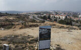 A new housing project sign stands in the Jewish West Bank settlement of Ariel, Tuesday, Jan. 28, 2020. (AP/Ariel Schalit)