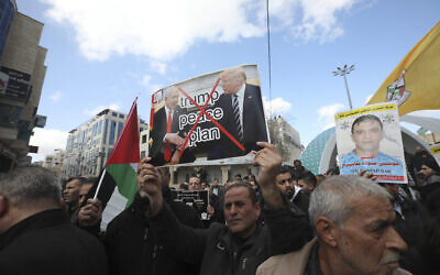 Palestinians protest the Mideast plan announced by US President Donald Trump, in Hebron, West Bank, January 30, 2020. (Mahmoud Illean/AP)