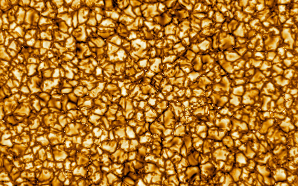 This undated photo provided by the National Science Foundation in January 2020 shows on of the Daniel K. Inouye Solar Telescope's first images of the sun, revealing its turbulent gas surface in what scientists called unprecedented detail. Prof. Jeffrey Kuhn of the University of Hawaii, Manoa says this image is about 10,000 kilometers (6,200 miles) on a side, and that the "bubbles" on the surface are about the size of Texas. (NSO/NSF/AURA via AP) This undated photo provided by the National Science Foundation in January 2020 shows on of the Daniel K. Inouye Solar Telescope's first images of the sun, revealing its turbulent gas surface in what scientists called unprecedented detail. Prof. Jeffrey Kuhn of the University of Hawaii, Manoa says this image is about 10,000 kilometers (6,200 miles) on a side, and that the "bubbles" on the surface are about the size of Texas. (NSO/NSF/AURA via AP)
