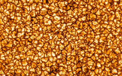 This undated photo provided by the National Science Foundation in January 2020 shows on of the Daniel K. Inouye Solar Telescope's first images of the sun, revealing its turbulent gas surface in what scientists called unprecedented detail. Prof. Jeffrey Kuhn of the University of Hawaii, Manoa says this image is about 10,000 kilometers (6,200 miles) on a side, and that the "bubbles" on the surface are about the size of Texas. (NSO/NSF/AURA via AP)
