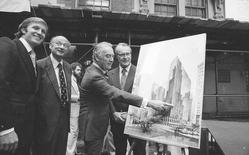 Governor Hugh Carey points to plans for a New York Hyatt Hotel/Convention facility, June 28, 1978.  At the launching ceremony are, from left:  Donald Trump, son of the city developer Fred C. Trump; Mayor Ed Koch of New York; Carey; and Robert T. Dormer, executive vice president of the Urban Development Corp.  (AP Photo)