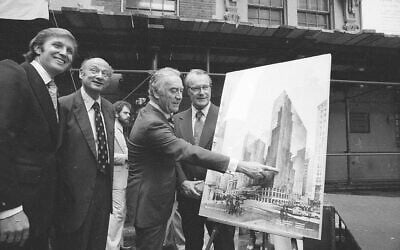 Governor Hugh Carey points to plans for a New York Hyatt Hotel/Convention facility, June 28, 1978.  At the launching ceremony are, from left:  Donald Trump, son of the city developer Fred C. Trump; Mayor Ed Koch of New York; Carey; and Robert T. Dormer, executive vice president of the Urban Development Corp.  (AP Photo)