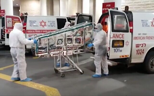 Screen capture from video of a Chinese laborer, suspected of suffering from the cornoavirus, being brought to Barzilai Medical Center, January 2020. (Ynet news) Screen capture from video of a Chinese laborer, suspected of suffering from the cornoavirus, being brought to Barzilai Medical Center, January 2020. (Ynet news)