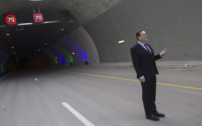 Then-Transportation Minister Yisrael Katz poses for a picture during a ceremony opening the new Harel tunnels on highway 1, the Tel Aviv-Jerusalem Road, on January 19, 2017. (Yonatan Sindel/Flash90)