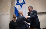Knesset Speaker Yuli Edelstein (R) embraces Amir Ohana after the latter's appointment as justice minister, at the Knesset in Jerusalem on June 12, 2019. (Yonatan Sindel/Flash90)