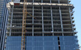 Illustrative: Scaffolding at a construction site in downtown Tel Aviv, August 13, 2019. (Gili Yaari / Flash90)