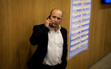 Defense Minister Naftali Bennett arrives at the Knesset to file the national-religious Yamina alliance's list of candidates for the upcoming elections, January 15, 2020. (Olivier Fitoussi/Flash90 )