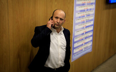 Defense Minister Naftali Bennett arrives at the Knesset to file the national-religious Yamina alliance's list of candidates for the upcoming elections, January 15, 2020. (Olivier Fitoussi/Flash90 )