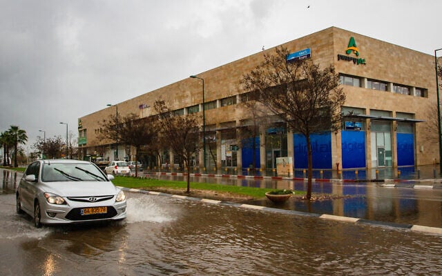 A flooded road after heavy rainfall in the central city of Netanya, on January 19, 2020. (Flash90) A flooded road after heavy rainfall in the central city of Netanya, on January 19, 2020. (Flash90)