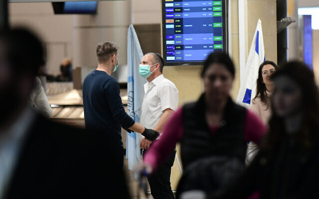People wearing face masks at the arrival hall of the Ben Gurion Airport, near Tel Aviv, January 28, 2020. (Tomer Neuberg/Flash90) People wearing face masks at the arrival hall of the Ben Gurion Airport, near Tel Aviv, January 28, 2020. (Tomer Neuberg/Flash90)
